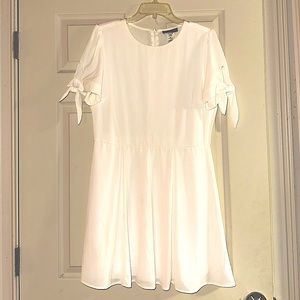 White short sleeve dress with tie detail on sleeves. Size 15/16